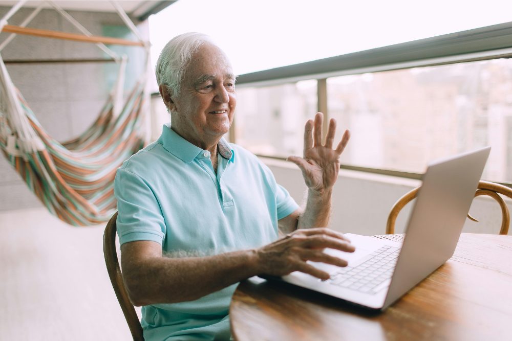 Man sitting using a laptop